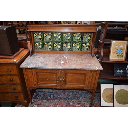 585 - An early 20th century mahogany washstand, high tiled half-gallery back above a rectangular marble to... 