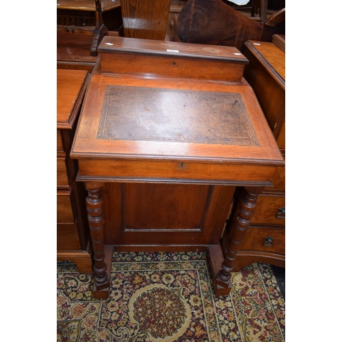 589 - An early 20th century mahogany Davenport, moulded rectangular top enclosing a fitted interior above ... 