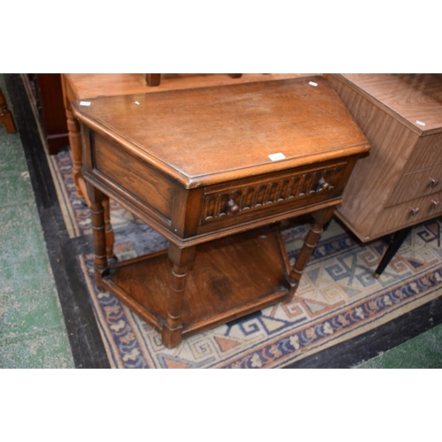 604 - A 17th century style oak side cabinet