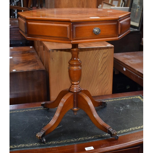 622 - A reproduction octagonal inlaid mahogany occasional table, two frieze drawers, reeder feet, lion paw... 