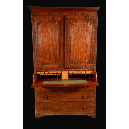 628 - A George IV mahogany secretaire linen press, stepped cornice above a pair of rectangular panel doors... 