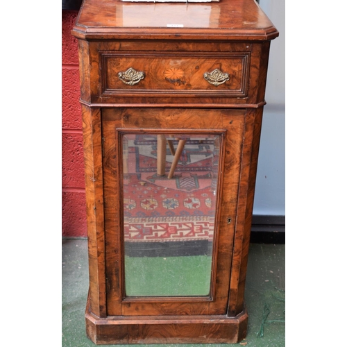 121 - An early 20th century walnut and mahogany music cabinet, slightly oversailing chamfered rectangular ... 