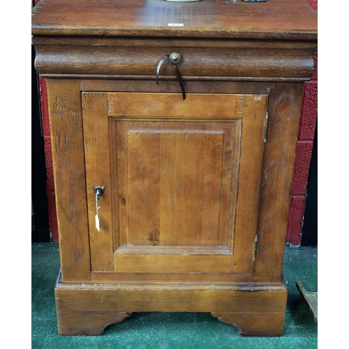 125 - A substantial 20th century oak side cabinet, rectangular top above a long frieze drawer and a raised... 