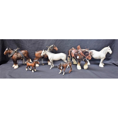 132 - A Beswick model of a grey horse standing, matte; others, Shire Foal and Dipped Head Foal, both brown... 