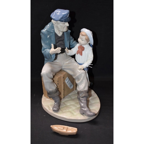 141 - A Lladro figure group, Fisherman and Boy, 5207