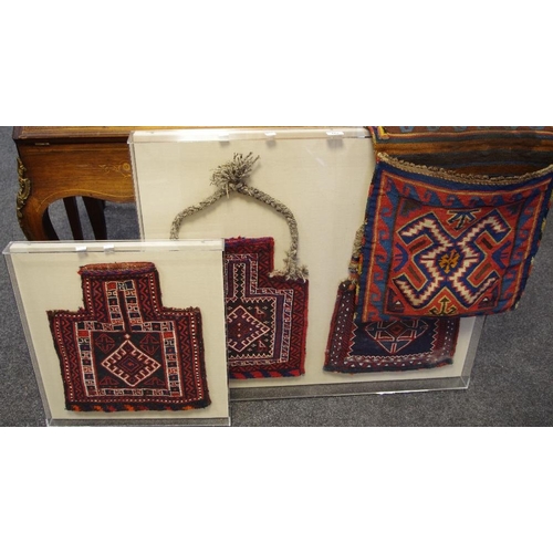 182 - Textiles - a middle eastern hand knotted two section saddle bag; other bags cased (4)