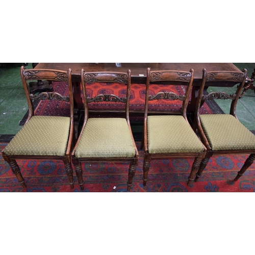 157 - A set of four Regency mahogany dining chairs, rectangular cresting rail carved and applied with scro... 