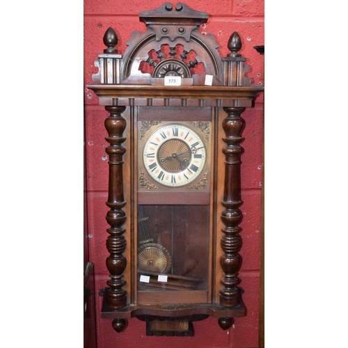 175 - A mahogany cased Vienna type wall clock, Roman numerals, turned supports