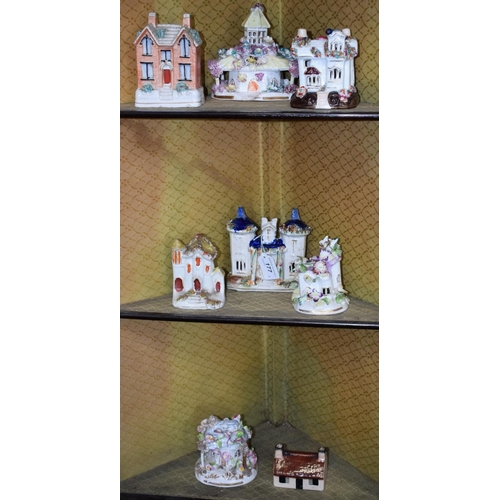 177 - Ceramics - a 19th century Staffordshire Cottage pastille burner; others, money banks; etc (8)