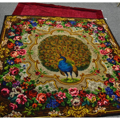 123A - Textiles - a 1950s chenille throw, the central field decorated with a peacock, feathers in full disp... 