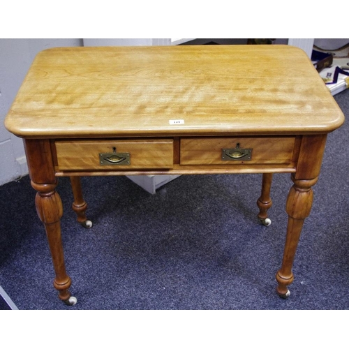 149 - A Victorian bleached mahogany writing desk, rounded rectangular top, two short drawers to frieze, br... 