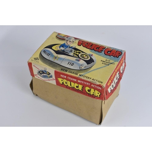 104 - Tinplate - a police car, with new crank mystery action and big emergency siren, made in Japan, in or... 