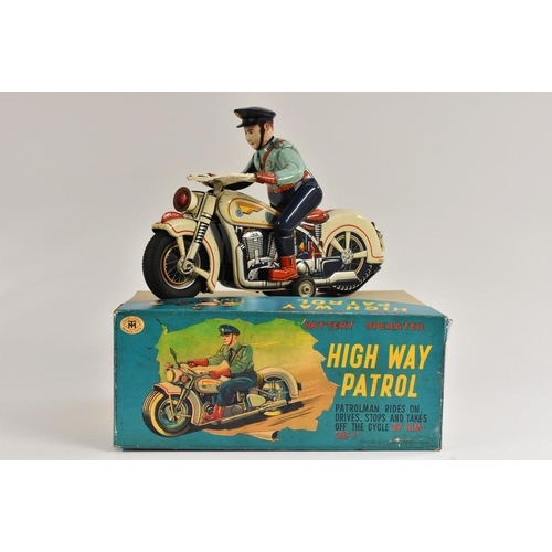 106 - A Modern Toys, Japan, High Way Patrol, battery operated, patrolman rides on, drives, stops and takes... 