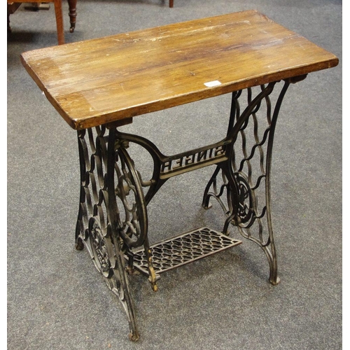 158 - A Singer treadle sewing machine base converted to a table.