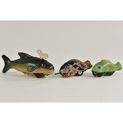109 - A tinplate clockwork fish,  the fish sparks, made in US Zone, Germany;  two others, Japanese