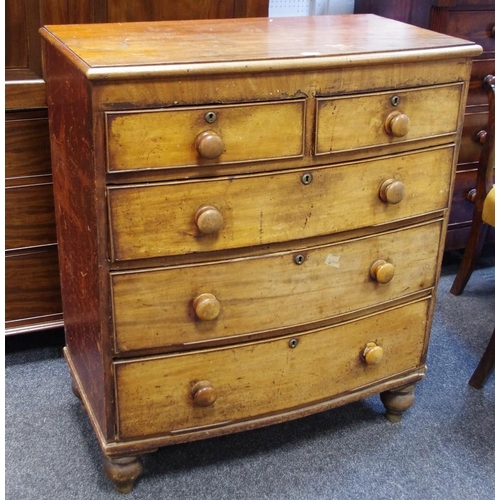 169 - A Victorian bowfront chest of two short cockbeaded drawers over three long, bun handles, turned feet... 