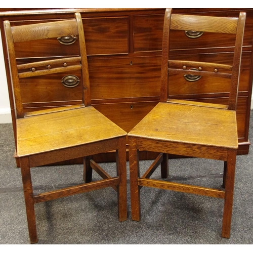 180 - A pair of 19th century oak farmhouse hall chairs.