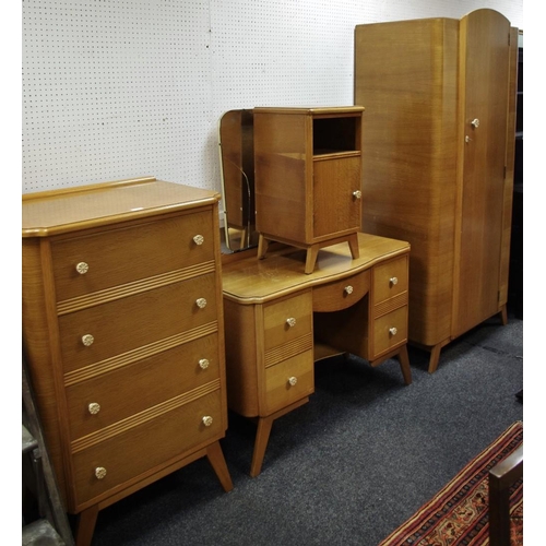 189 - A 1950's retro bedroom suite by Homeworthy comprising, wardrobe, four drawer tall chest; dressing ta... 