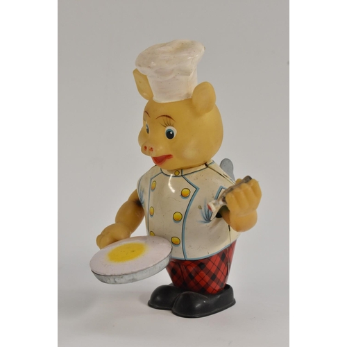 131 - A Japanese Tinplate Clockwork Piggy Cook