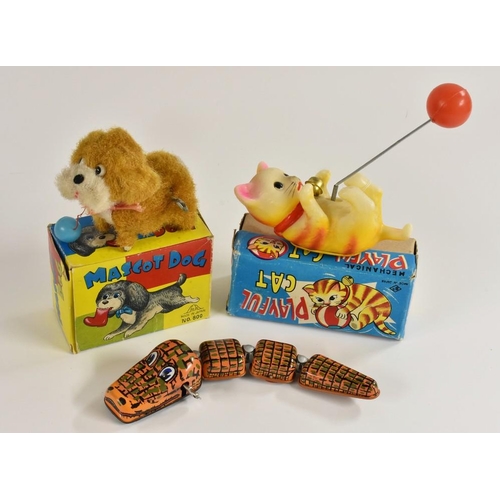 137 - A Japanese Mascot Dog, windup toy, tinplate and plastic, in original box; a Happy Crocodile, windup ... 