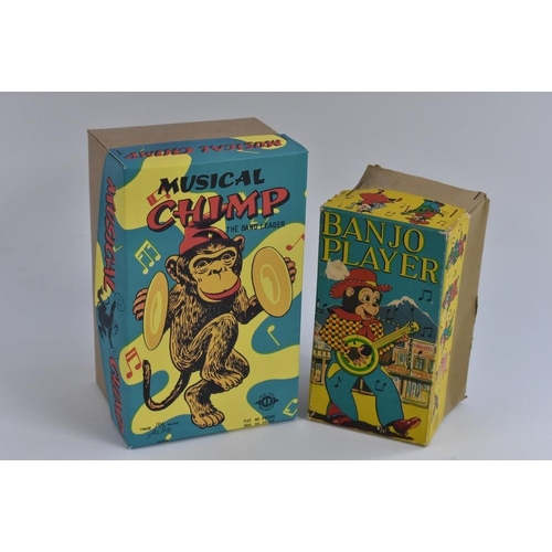 139 - A Japanese Musical Chimp, windup toy, reproduction box; a Banjo Player, tinplate and plastic, made b... 