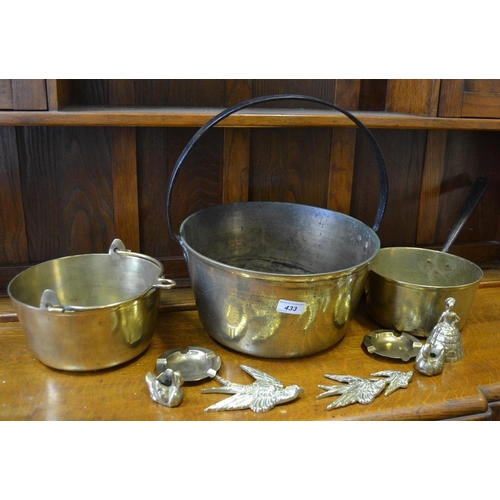 433 - A 19th century brass jam pan, another smaller; 19th century brass saucepan; etc