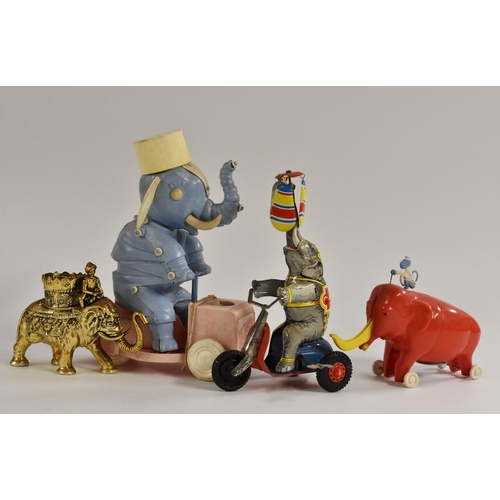 150 - A West German tinplate, Elephant on Cycle, made in US Zone, windup toy, in original box; a pull alon... 