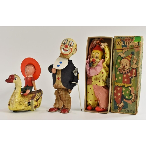 156 - A  Cragston mechanical tin plate Circus Clown, with aerial  tightrope, original box; a clockwork Clo... 