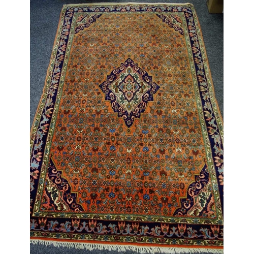 235 - A Hand Woven Persian Bijar Rug, geometric and floral designs in Taupe indigo, pink and cream on a br... 