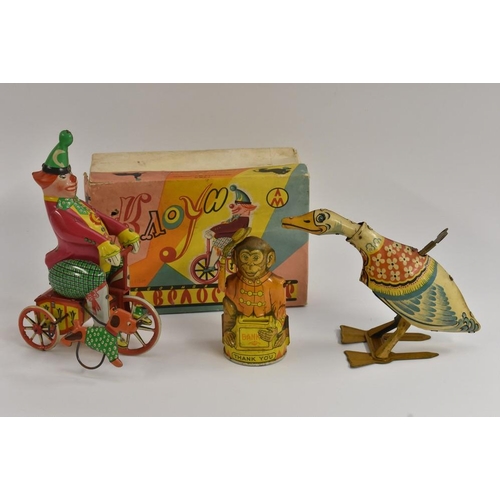 162 - A Marx tinplate, Goose, windup toy; a  Monkey bank, made in USA; a Cycling Clown and dog, windup toy... 