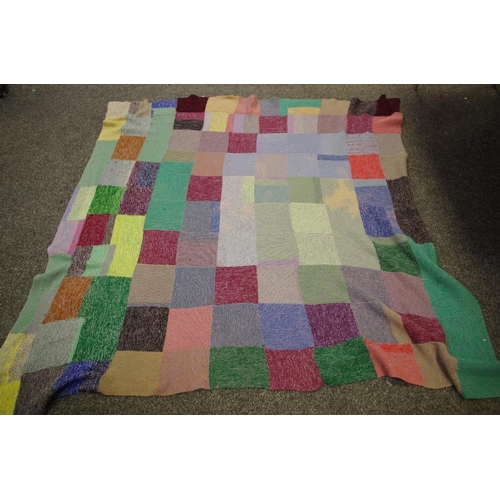 239 - A mid 20th century knitted woollen patchwork  double bed throw