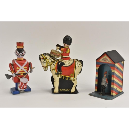166 - Tinplate - Drummer on Horse, windup toy, made in Great Britain; Guards money box; Drummer, windup to... 