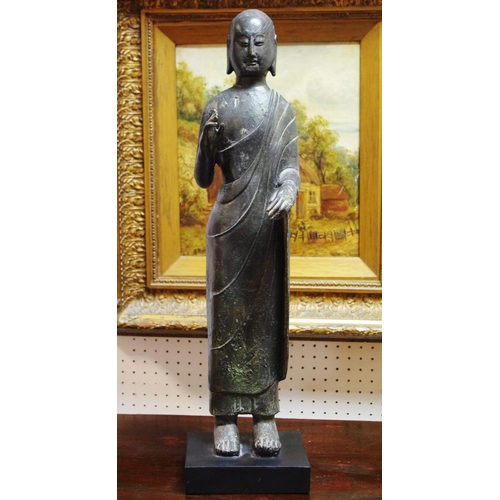 242 - Interior design - a free standing figure of Buddha, plinth base, Initialed MMA.