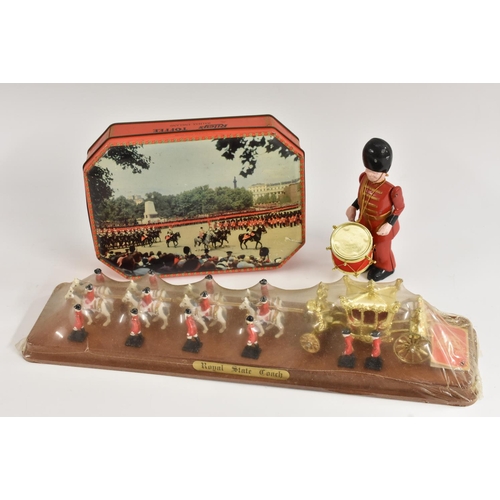 167 - Drumming Soldier, cast iron; Royal State Coach, in original box; Toffee tin, by Rileys, showing Chan... 