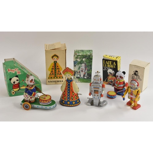 170 - Tinplate - Russian doll, in original box; Drumming Animal, clockwork, made in China, in original box... 