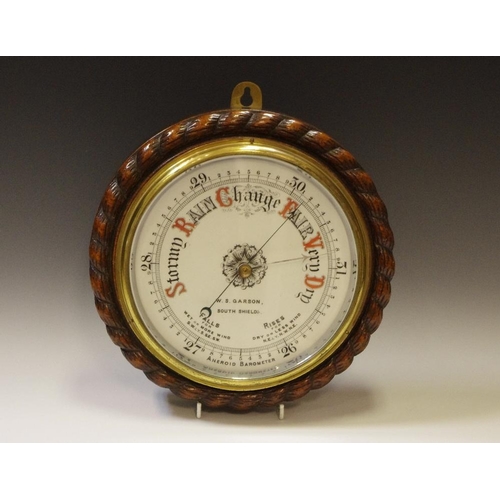 25 - A Victorian oak cased Aneroid barometer, the 19cm circular porcelain dial  inscribed W S Garson, Sou... 