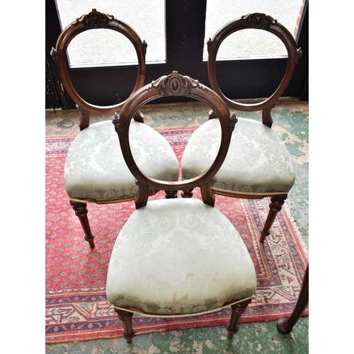 433 - A set of three late Victorian style mahogany side chairs, each with an open back cresting by carved ... 