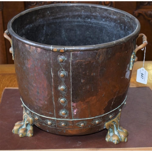 447 - A copper log bucket, brass paw feet, 36cm diameter