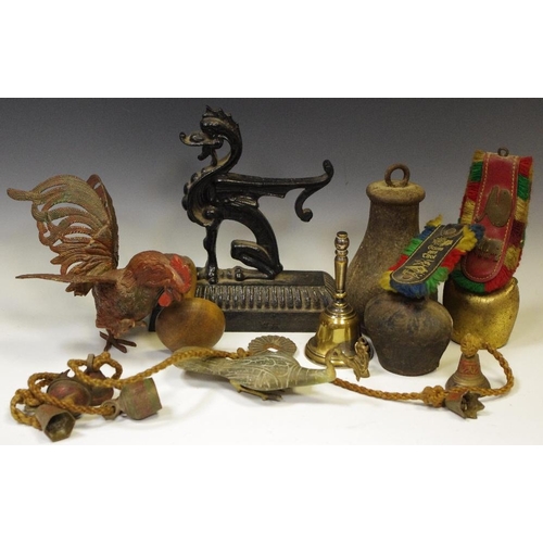 266 - Curio - An Egyptian carved stone and gilt metal Ibis sculpture; Swiss cow bells; Indian temple bells... 