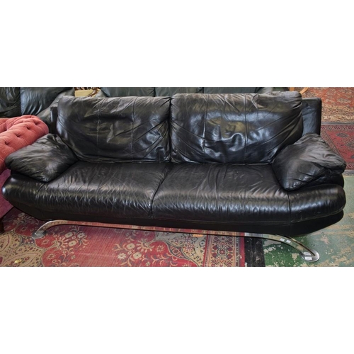 454 - A contemporary black leather sofa, chromium legs