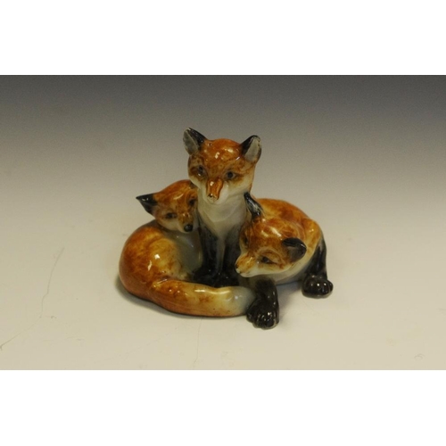 276 - A Royal Worcester animal model,  of three fox cubs,  printed crown and circle mark in puce, model no... 