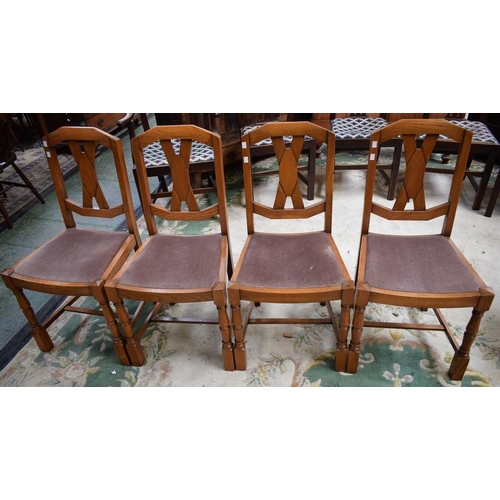 462 - A set of four oak dining chairs