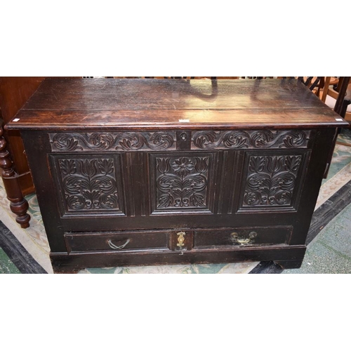 466 - An 18th century oak blanket chest, of large proportions, moulded hinged rectangular top above a thre... 