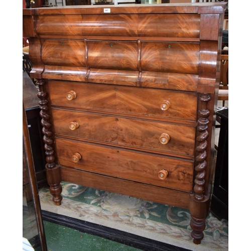 467 - A Victorian flame mahogany Scotch chest, hipped rectangular top above one long and three short serpe... 