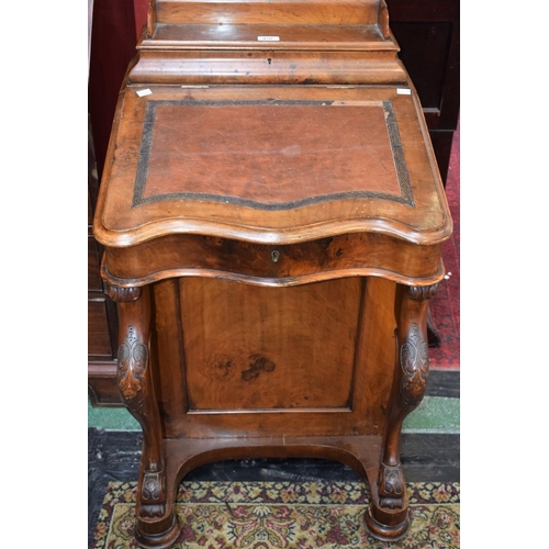 470 - A Victorian walnut Davenport, the superstructure with a three-quarter galleried hinged cover enclosi... 