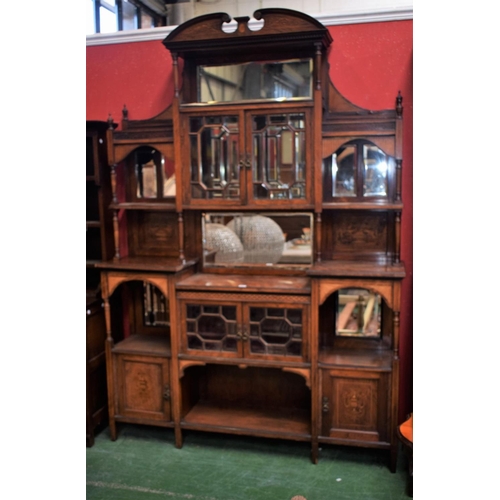 472 - An Edwardian salon display cabinet, swan neck pediment above a dentil frieze and a rectangular bevel... 