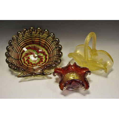 327 - Art Glass - a large shell shaped dish, sworls of red, greens and gold; a glass basket with gold flec... 