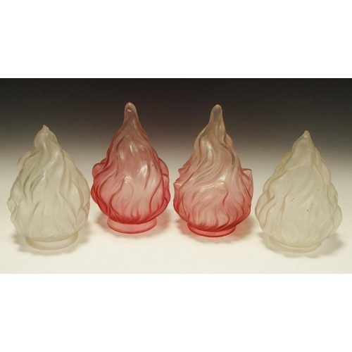 343 - A pair of frosted glass lamp covers in the form of stylised flames; another pair similar cranberry g... 