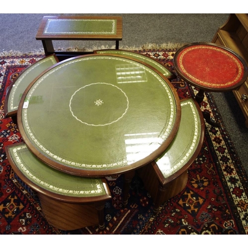 353 - A reproduction mahogany leather inlaid nested circular coffee table; a conforming occasional table/m... 