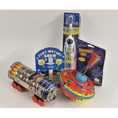 28 - Space Toys - an astronaut toothbrush and space game, in original packaging; a spinning top, with spa... 